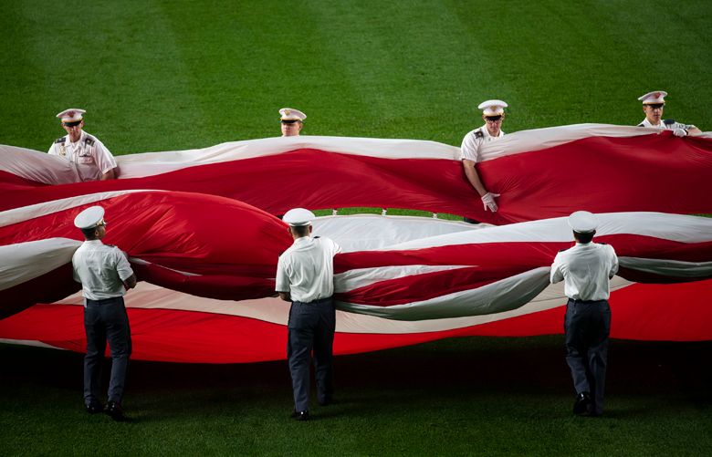 FILE — A flag ceremony before Game 3 of the American League Division Series between the New York Yankees and Boston Red Sox at Yankee Stadium in New York, Oct. 8, 2018. “In other ways, our failure in Afghanistan more closely resembles Roman failures that took place far from Rome itself Ñ the defeats that Roman generals suffered in the Mesopotamian deserts or the German forests, when the empireÕs reach outstripped its grasp,” writes The New York Times opinion columnist Ross Douthat. (Karsten Moran/The New York Times)