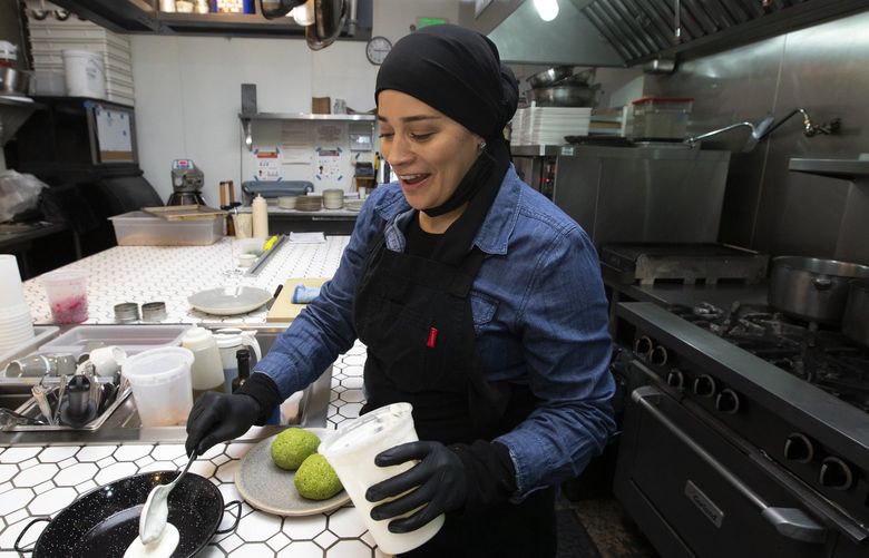Sheena Eliz is executive chef at the Georgetown restaurant Ciudad, Thursday, Sept. 23, 2021. Eliz prepares two Scotch Egg Falafels. 218255