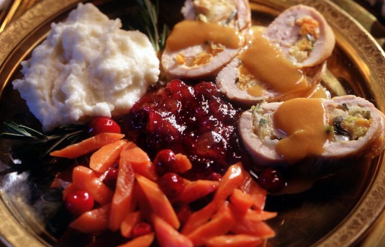 Thanksgiving dinner : FOR A CHANGE , TRY TURKEY ROULADE WITH APRICOT STUFFING, GLAZED CARROTS, MASHED-POTATO CASSEROLE AND CRAN-APPLE SAUCE. (2 OF 2 )