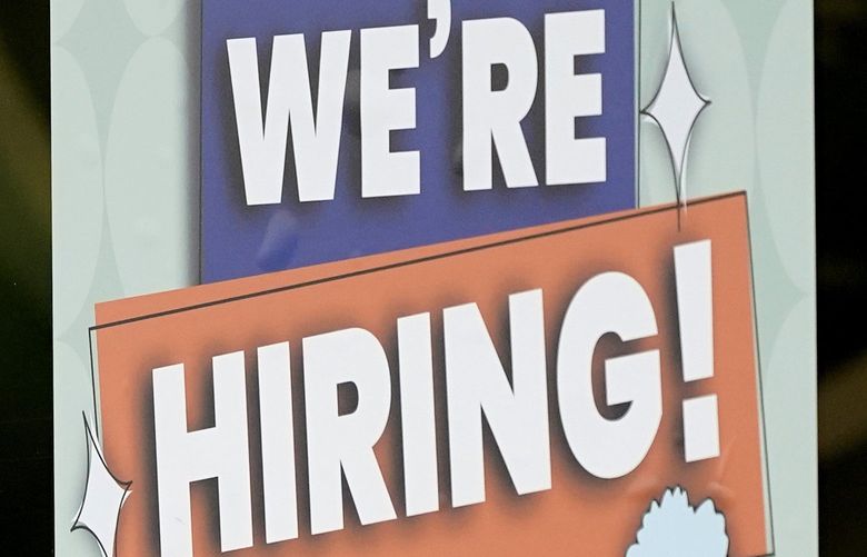 A hiring sign is seen at a Stella’s Place cafe in Des Plaines, Ill., Sunday, July 11, 2021.  Americans have started millions of new businesses in the last 18 months. As those businesses grow, many owners will consider hiring their first employees.  (AP Photo/Nam Y. Huh)