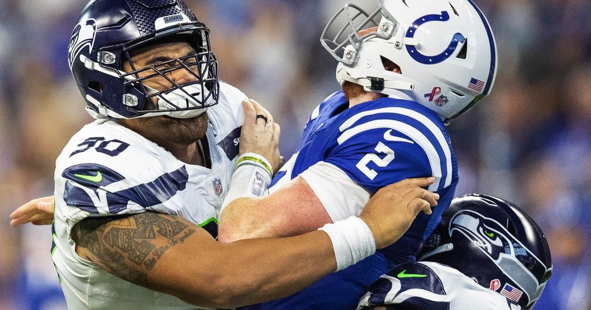 Seattle Seahawks wide receiver DK Metcalf (14) is tackled by Indianapolis  Colts safety Khari Willis (37)