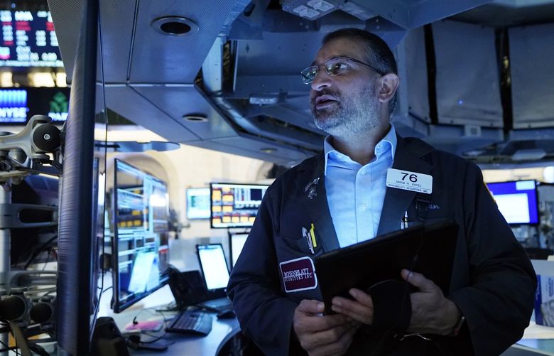 Trader Aman Patel works on the floor of the New York Stock Exchange, Wednesday, Sept. 29, 2021. Stocks rose modestly in morning trading on Wall Street Wednesday as the market regains its footing following a sharp drop a day earlier. (AP Photo/Richard Drew) NYRD305 NYRD305