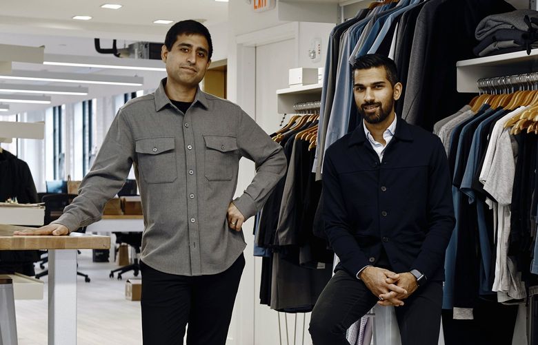 Gihan Amarasiriwardena, right, with his Ministry of Supply co-founder Aman Advani, at the apparel company’s offices in Boston on Feb. 24, 2021. The brand paid about $1.50 per $125 shirt in transportation costs before the pandemic; now, they say, the cost is nearly $6. (Tony Luong/The New York Times)