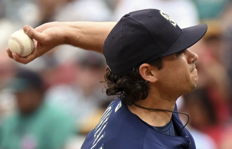 Seattle Mariners pitcher Marco Gonzales throws to home plate during the first inning of a baseball game against the Los Angeles Angels, Sunday, Sept. 26, 2021, in Anaheim, Calif.