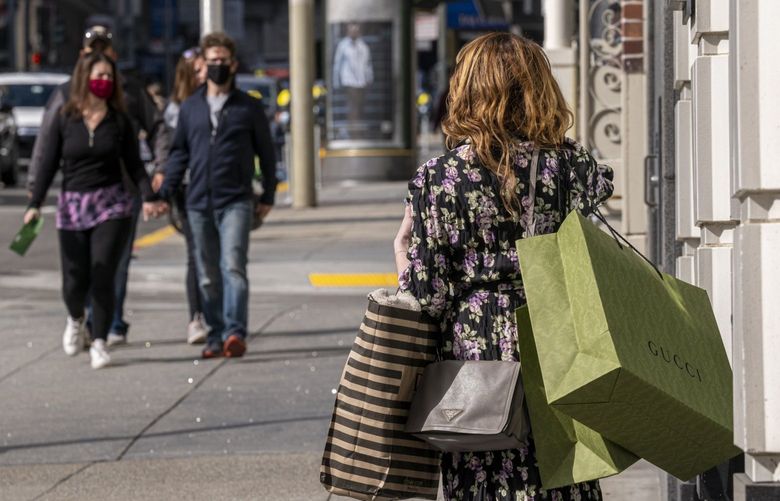 A pedestrian carries shopping bags in San Francisco on Sept. 16, 2021. MUST CREDIT: Bloomberg photo by David Paul Morris.