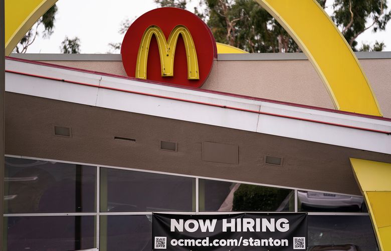 A hiring banner hangs outside a McDonald’s fast-food restaurant in Stanton, Calif., Monday, May 17, 2021. (AP Photo/Jae C. Hong)