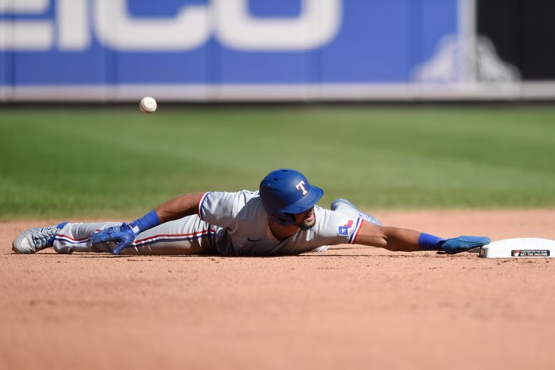 Texas Rangers outfielders Charlie Culberson, left, Leody Taveras