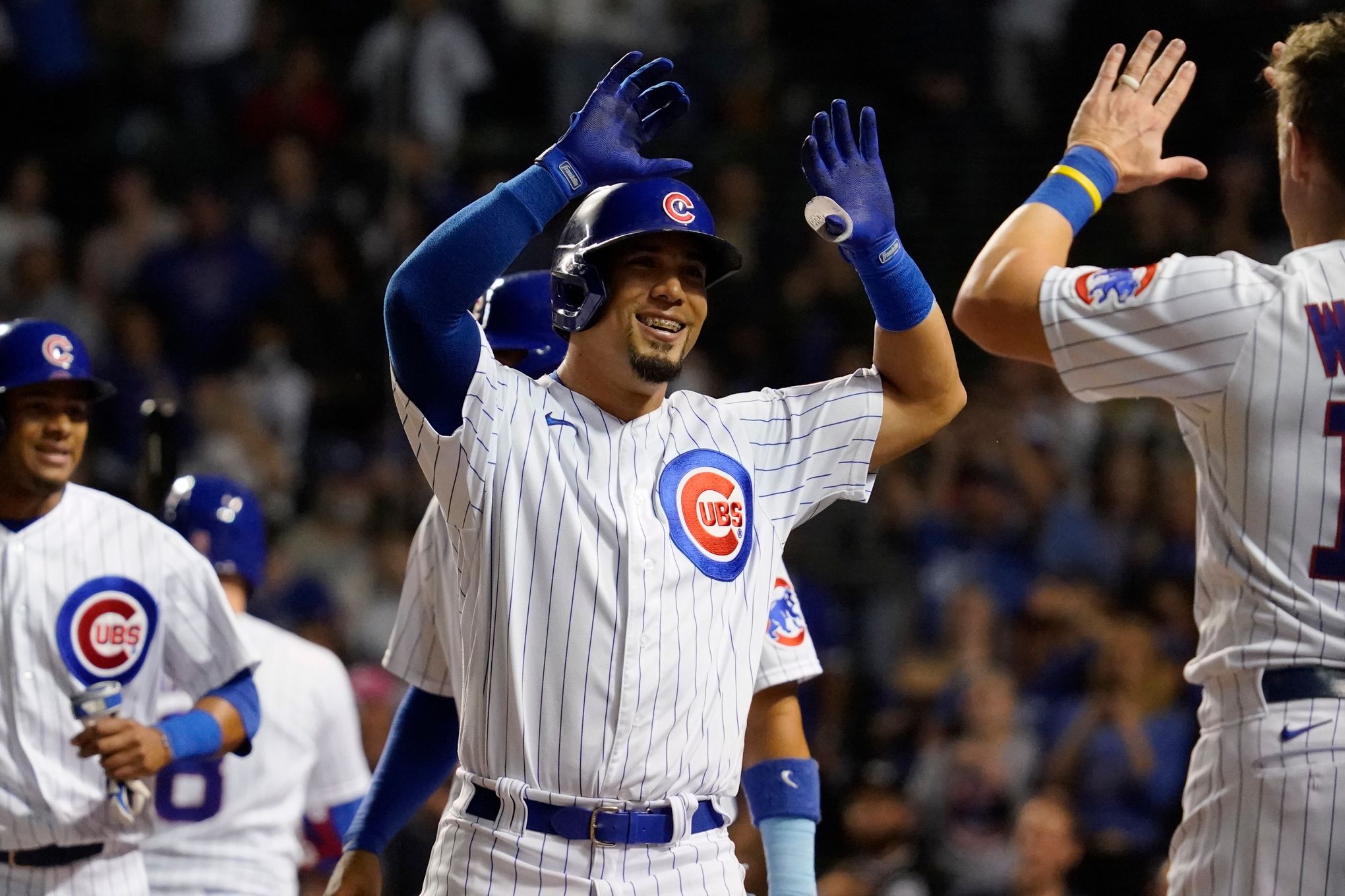 The Chicago Cubs' Frank Schwindel, Rafael Ortega, and Patrick