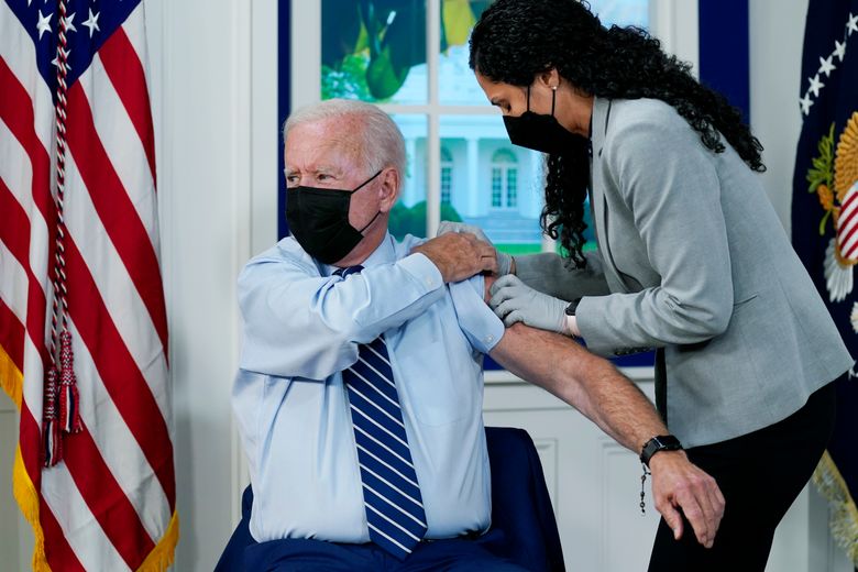 President Joe Biden receives a COVID-19 booster shot during an event in the South Court Auditorium on the White House campus, Monday, Sept. 27, 2021, in Washington. (Evan Vucci / The Associated Press)