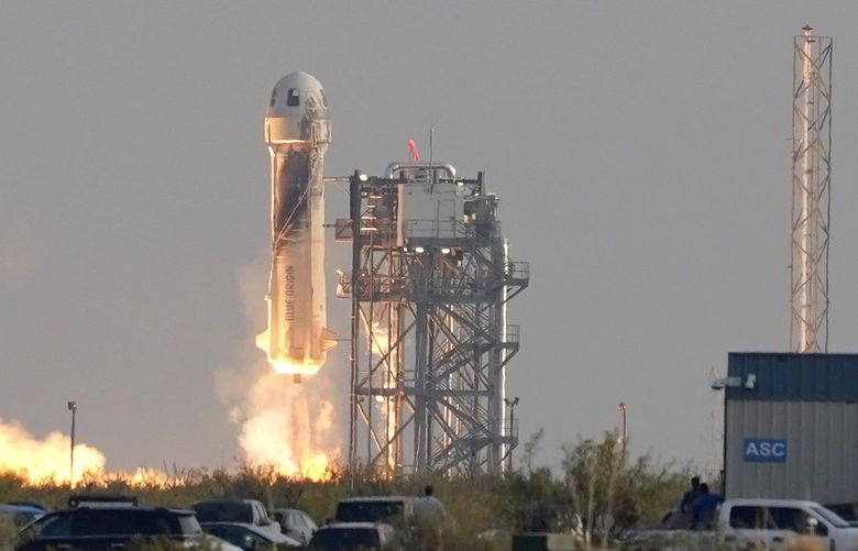 Blue Origin’s New Shepard rocket launches carrying passengers Jeff Bezos, founder of Amazon and space tourism company Blue Origin, brother Mark Bezos, Oliver Daemen and Wally Funk, from its spaceport near Van Horn, Texas, Tuesday, July 20, 2021. (AP Photo/Tony Gutierrez) TXTG119 TXTG119