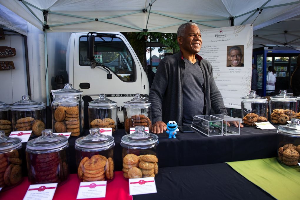 Business pre-pandemic was mostly through farmers markets, and things were going extremely well for Michael Pinckney. But after the COVID-19 pandemic started, and farmers markets shut down, Pinckney took Pinckney Cookie Cafe online. Many loyal customers followed him there. Now that farmers markets have reopened, many customers are back at his booth. (Bettina Hansen / The Seattle Times)