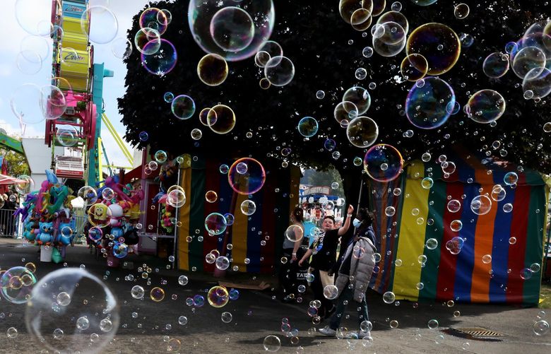 Bubbles from a vendor’s booth selling products that produce them attracts attention from fairgoers at the Washington State Fair in Puyallup.    The fair continues through Sunday.


Ref to more photos online


 LO Washington State Fair

Thursday Sept 23, 2021 218311