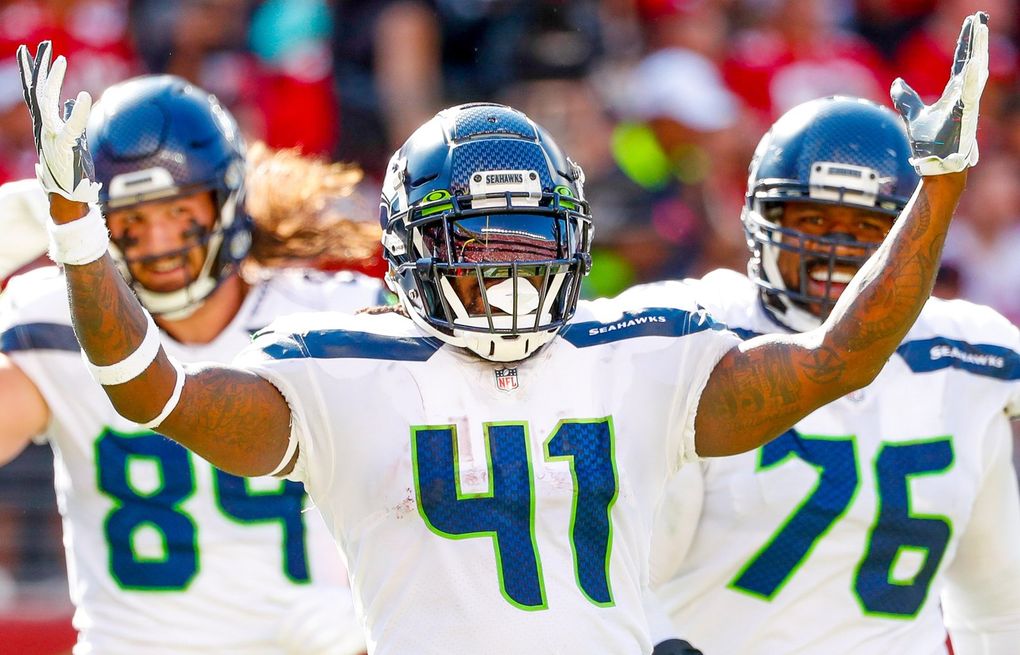 Seattle Seahawks' Alex Collins (41) celebrates a TD during an NFL