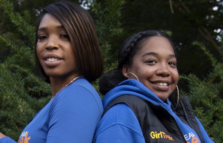 Myke Cain, left, and Trina Baker are outdoor representatives for GirlTrek in Seattle, seen at Seward Park, Monday, Oct. 4, 2021 in Seattle. 218345