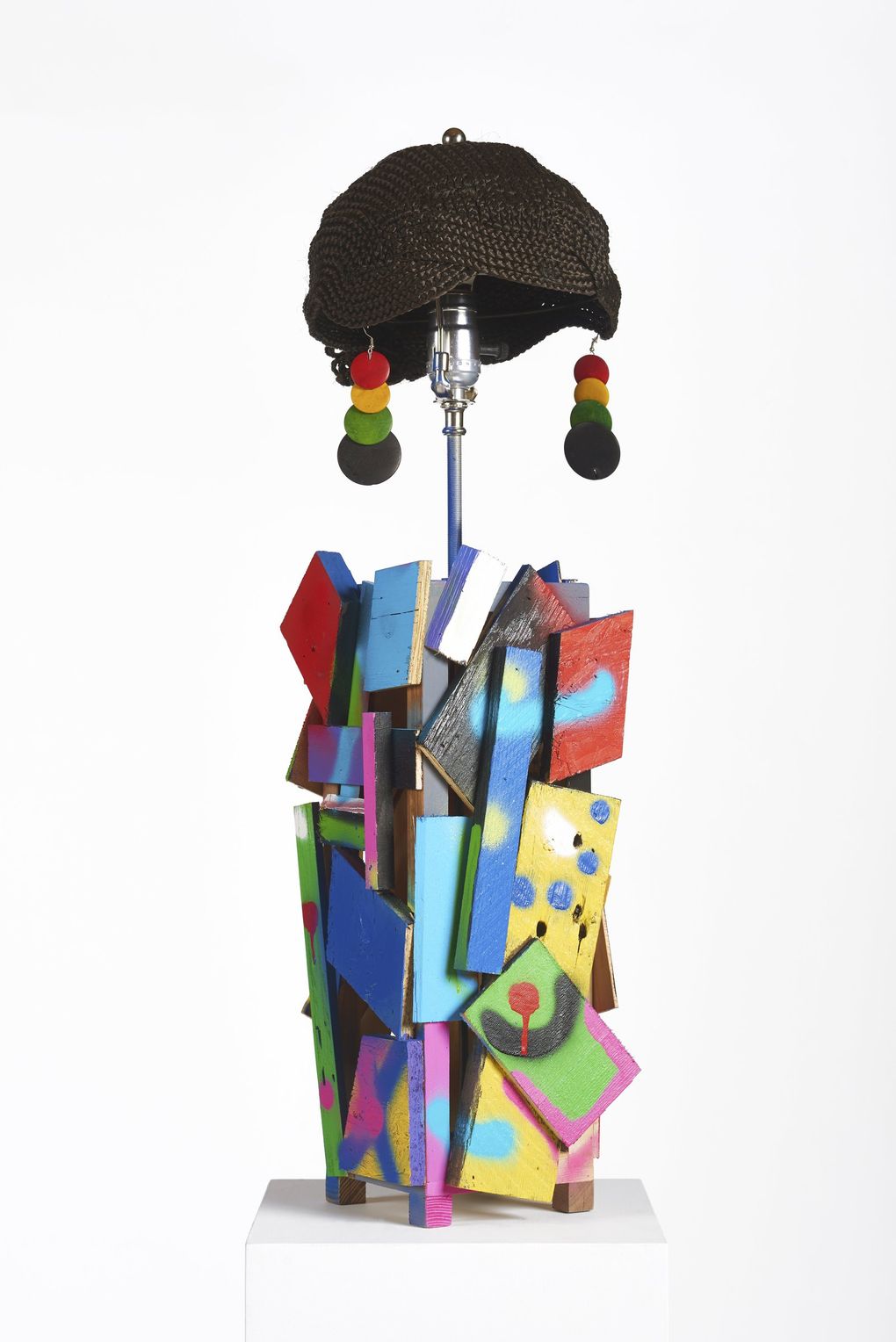 A lamp created by Derrick Adams is one of the works that greets visitors at the entrance to the exhibit. (Andy Romer)