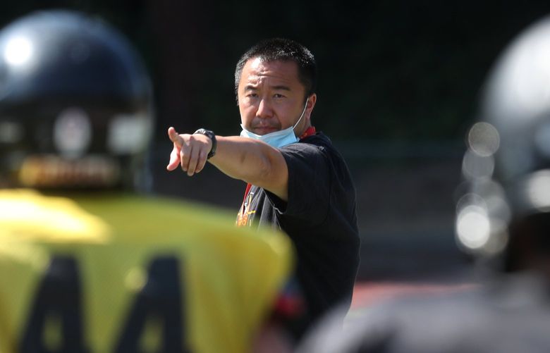 Lincoln high school head football coach Masaki Matsumoto keeps practice going at a fast pace, Monday, July 12, 2021 in Tacoma. 217587