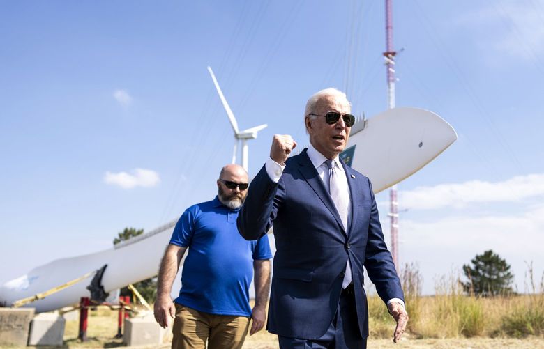 FILE – President Joe Biden tours wind turbines at the National Renewable Energy Laboratory in Arvada, Colo., Sept. 14, 2021. Climate provisions in two massive spending bills would spur big changes in energy and transportation and help communities prepare for  disasters that are growing more frequent. (Doug Mills/The New York Times)