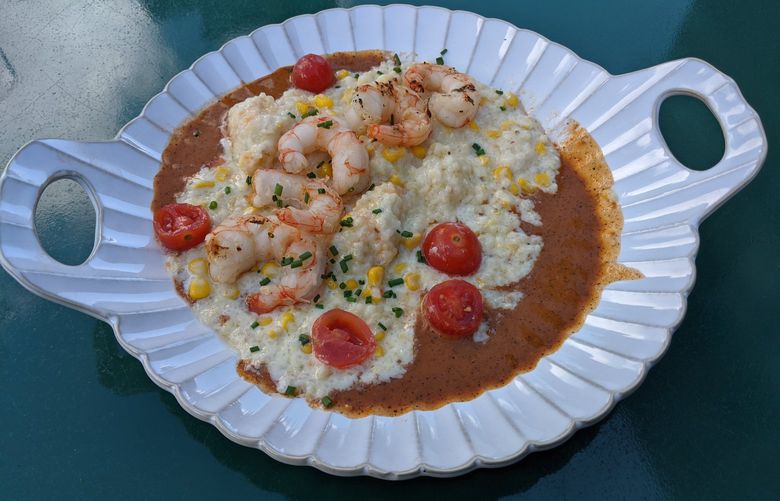 The shrimp and grits at Kenmore’s recently opened Cedar + Elm features thick, cheesy grits served atop a spicy tomato broth.