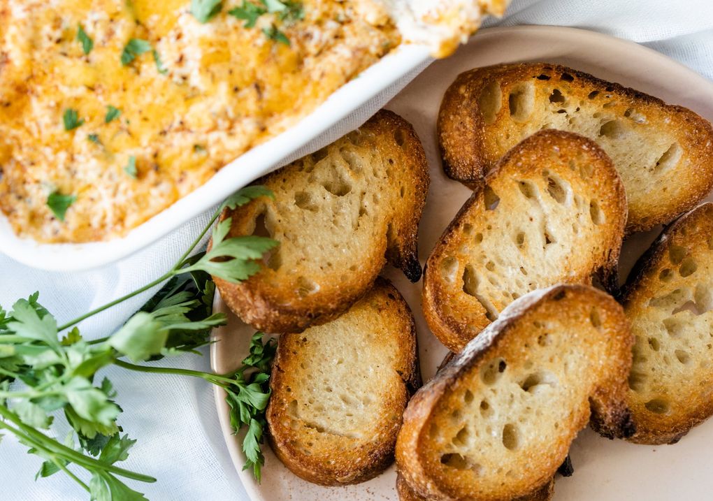 Pair your seafood dip with the dips of your choice for this heartwarming Seattle seafood and cheese dip.  Hot and crispy crostini work great!  (Danie Baker / Special for the Seattle Times)