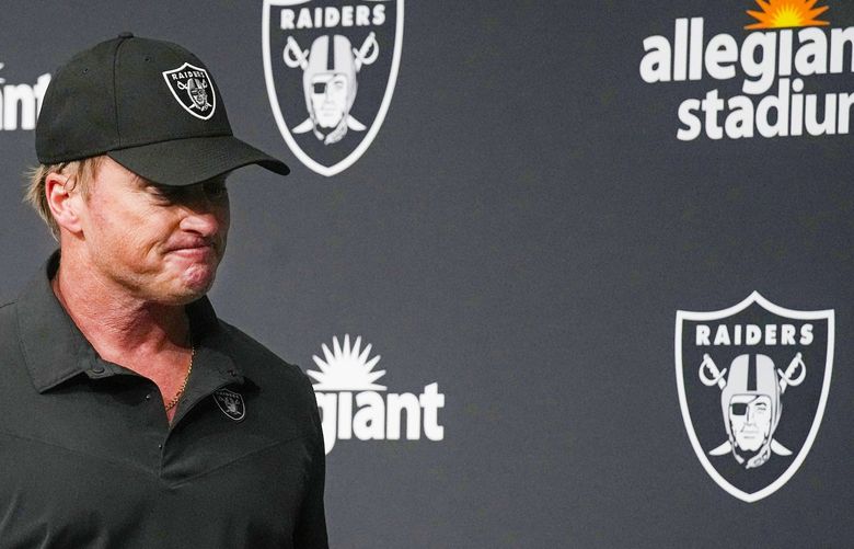 Las Vegas Raiders head coach Jon Gruden leaves after speaking during a news conference after an NFL football game against the Chicago Bears, Sunday, Oct. 10, 2021, in Las Vegas. (AP Photo/Rick Scuteri) NYOTK