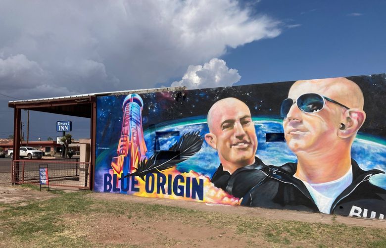 The side of a building in Van Horn, Texas, is adorned with a mural of Blue Origin founder Jeff Bezos on Saturday, July 17, 2021, just days before Bezos plans to launch into space from the Blue Origin spaceport about 25 miles outside of the West Texas town. (AP Photo/Sean Murphy) RPSM202