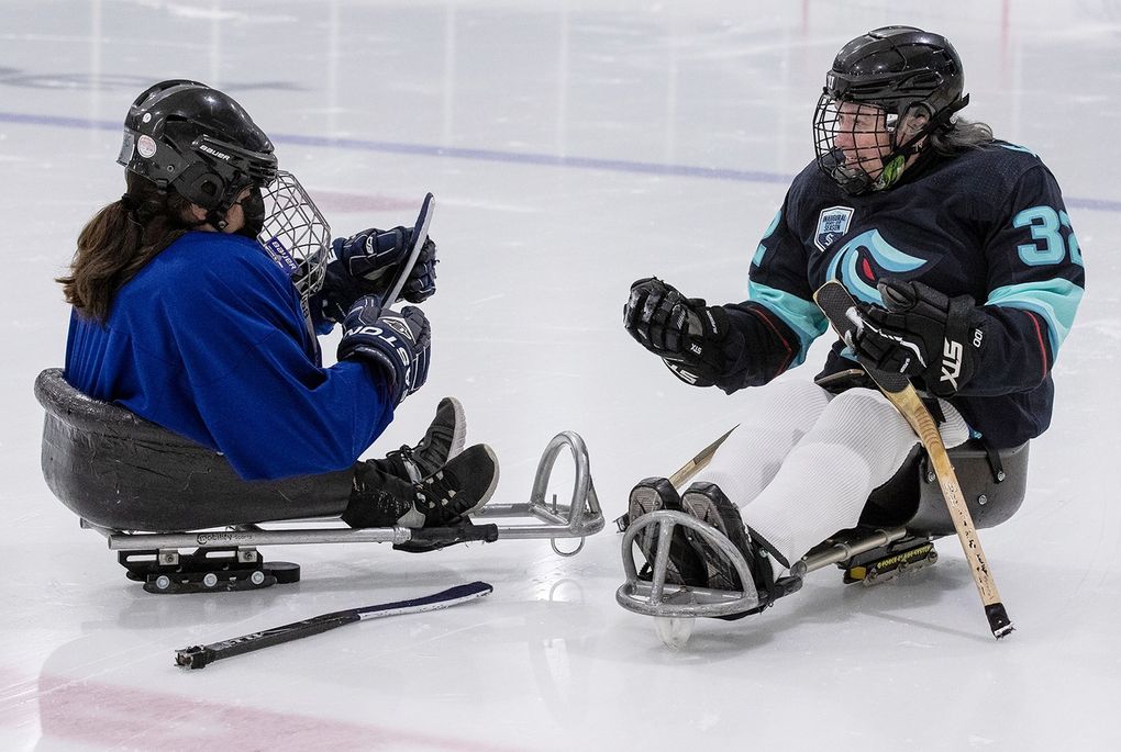 Leah Cupps (right) started played sled hockey for the first time in her forties and fell in love with the sport. “Being in the sleds makes everybody equal,” she said. (John Liston / )