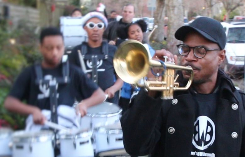 Owuor Arunga playing trumpet during Walk the Block 2020 at Garfield Community Center.