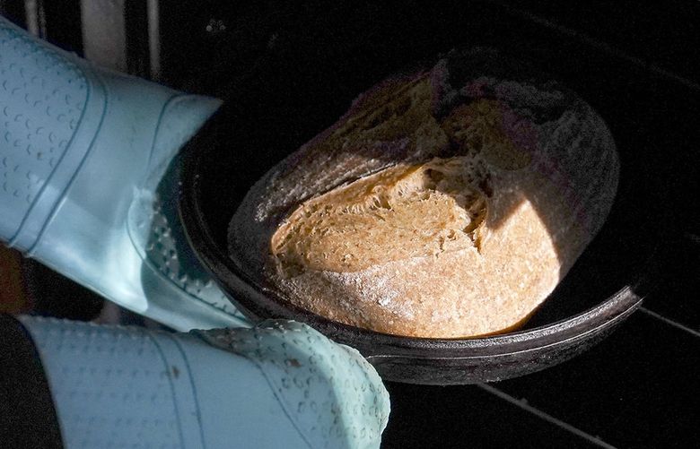 Jenny Starrs bakes a loaf of Kernza bread at Sarah Kaplan’s Washington, D.C., apartment.MUST CREDIT: Washington Post photo by Carolyn Van Houten