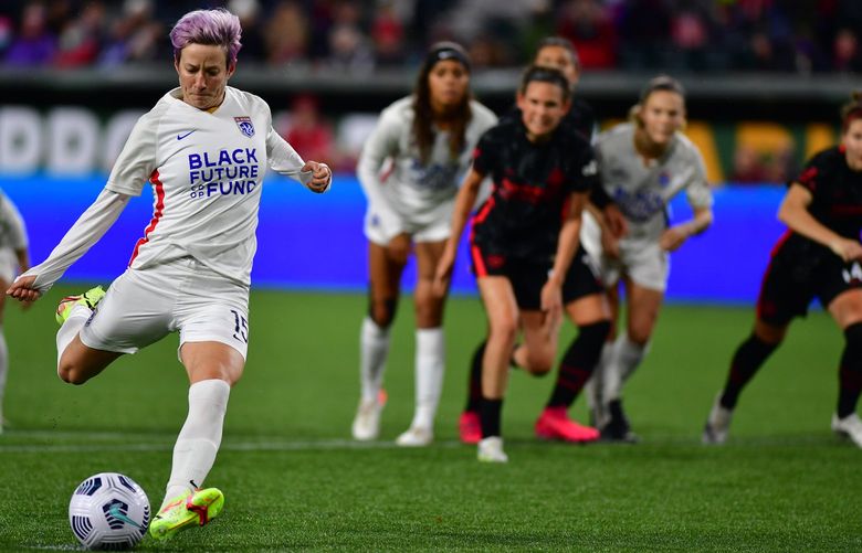Megan Rapinoe kicks a penalty kick at that 86-minute to level the score 1-1.