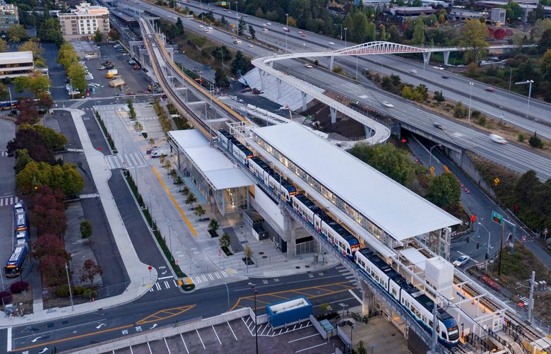 With downtown Seattle in the background, the soon-to-open Northgate light rail station is seen from the air at sundown, Monday, Sept. 20, 2021 in Seattle. The view looks southwest, with bus lanes to the left and Interstate 5 to the right. 218287 218287