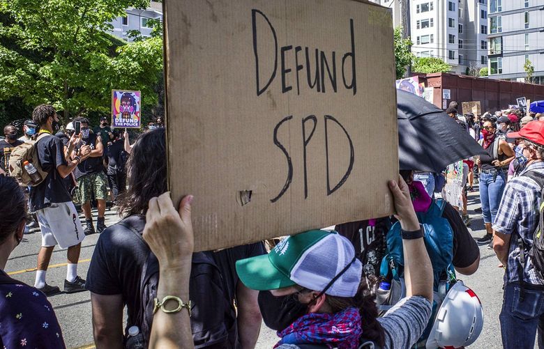 Wed. August 5, 2020 Marchers organized by Decriminalize Seattle and King County Equity Now start walking at 12th Ave. and E. Alder Street across from the new youth jail as marchers head downtown to City Hall to call for police defunding. 214679 214679