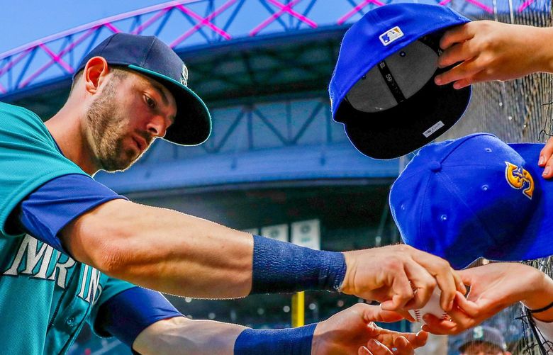 T-Mobile Park – Seattle Mariners vs. Los Angeles Angels – 100121
Seattle Mariners right fielder Mitch Haniger signs autographs before the start of a game against the Los Angeles Angels Friday, Oct. 1, 2021, in Seattle. 218395 218395