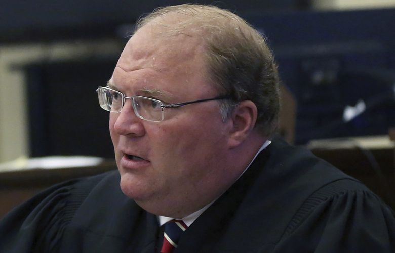 FILE- In this Sept. 17, 2015 file photo, then Wisconsin Supreme Court Justice Michael J. Gableman speaks during a court hearing at the Grant County Courthouse in Lancaster, Wis. The Republican-hired attorney leading the investigation into how the 2020 presidential election was run in Wisconsin is accusing Democratic Gov. Tony Evers of having “an incomplete and misguided view†of the probe. The comments former Justice Gableman made in a video posted online Saturday, Oct. 9, 2021, came less than two weeks after Evers called the taxpayer-funded investigation a “$700,000 boondoggle.†(Jessica Reilly/Telegraph Herald via AP, File) IADUB201 IADUB201