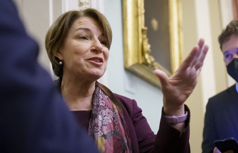Sen. Amy Klobuchar, D-Minn., chair of Senate Democratic Steering Committee, stops for questions by reporters after meeting with White House officials to work on a way to lift the debt limit without Republican votes, at the Capitol in Washington, Wednesday, Oct. 6, 2021. (AP Photo/J. Scott Applewhite) DCSA123 DCSA123