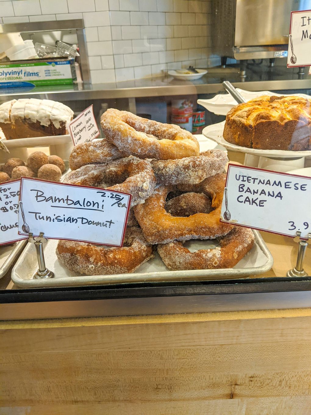 Head to Michou Deli for fluffy bambaloni, an oblong sugar-dusted Turkish doughnut. (Jackie Varriano / The Seattle Times)