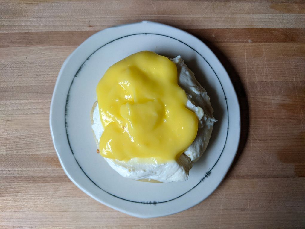 The Crumpet Shop is a favorite for fluffy, spongy crumpets toasted and topped with a dollop of ricotta and fresh lemon curd. (Jackie Varriano / The Seattle Times)