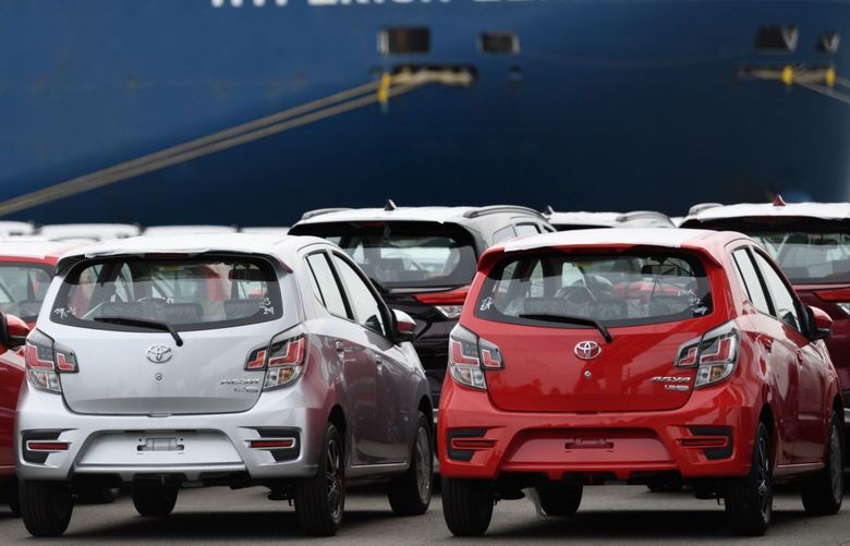 Toyota Motor Corp. Agya vehicles bound for shipment parked in front of a vehicle carrier ship at the Nagoya Port in Nagoya, Aichi Prefecture, Japan, on Monday, Aug. 23, 2021. The worsening chip shortage forced the world’s No. 1 automaker suspend output for several days at almost all its plants in Japan next month, forcing a 40% cut in production plans. 775699072