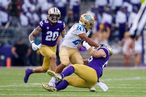 October 16, 2021: The Washington Huskies wore their throwback uniform  featuring the retro Huskies logo on the helmet during a game between the  UCLA Bruins and Washington Huskies at Husky Stadium in