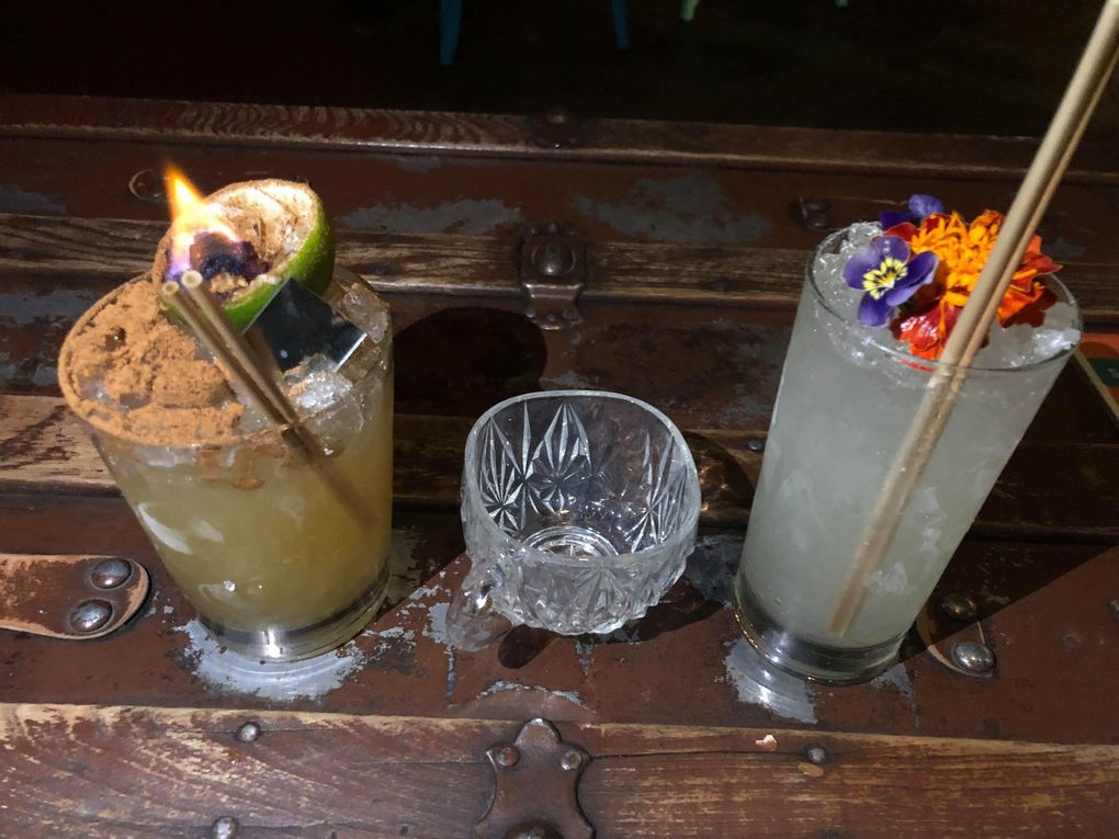 Navy Strength, a Belltown tiki bar, serves cocktails inspired by horror movies, like The “Candyman,” left, and a “Midsommar”-themed cocktail. (Jade Yamazaki Stewart / The Seattle Times)