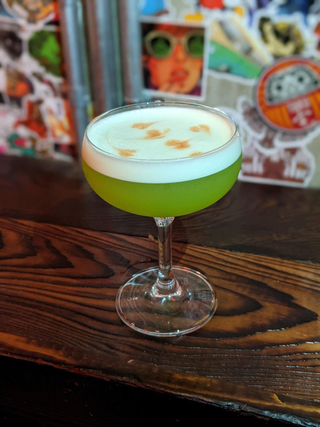 Shota Nakajima’s bar and fried chicken restaurant, Taku, is hosting Halloween events and has food and drink specials like The Eulogy, made with Midori, mezcal, green chartreuse, lime juice and Sichuan peppercorn tincture. (Courtesy of Taku)