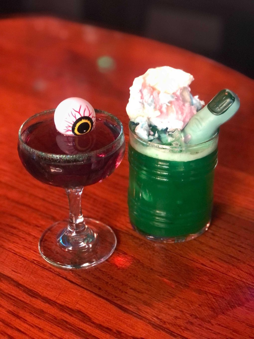Dreamland Bar and Diner in Fremont serves delicious Halloween coctails like the Viper Black with gin, blanc vermouth and apricot liqueur, left, and the Swamp Crawler, made with quince and apple liqueurs and brandy. (Courtesy of Dreamland Bar and Diner)