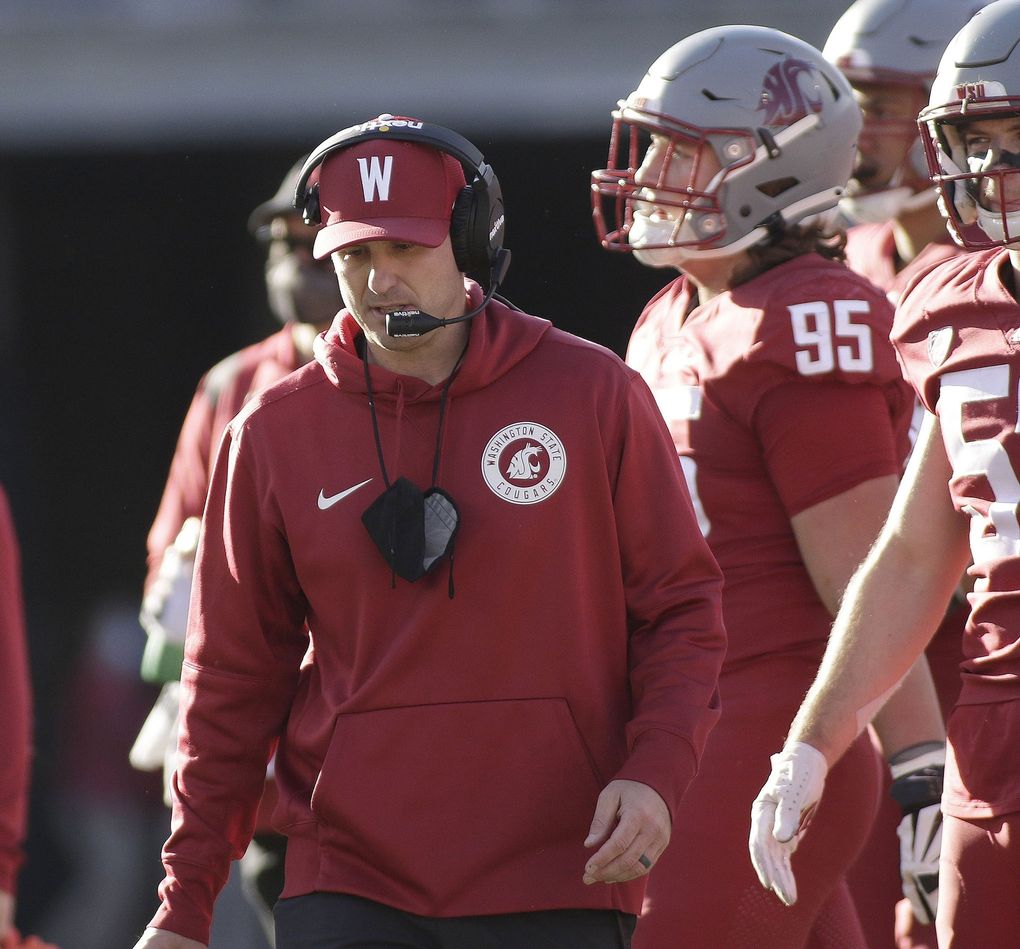 Washington State defensive coordinator and linebackers coach Jake Dickert stands on the field during a break in play in the second half of an NCAA college football game against Oregon State, Saturday, Oct. 9, 2021, in Pullman. (Young Kwak / The Associated Press)