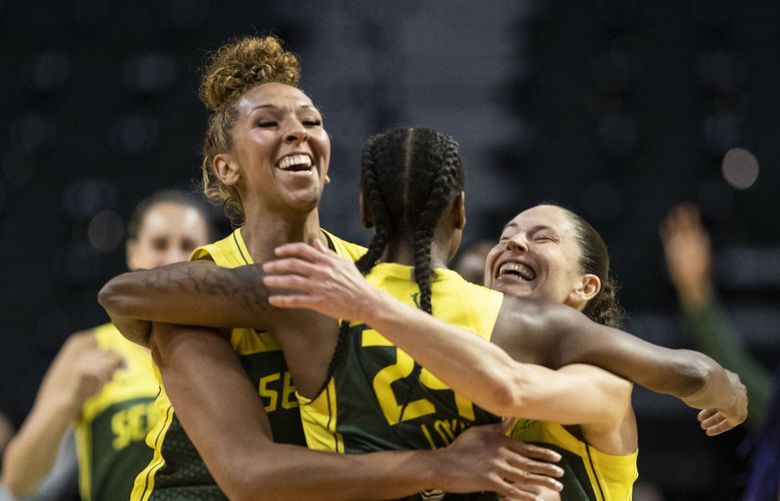 Mercedes Russell and Sue Bird grab Jewell Loyd following her game-winning shot with 0.8 seconds left on the clock in overtime. The Dallas Wings played the Seattle Storm in WNBA Basketball Friday, June 4, 2021 at Angel of the Winds Arena in Everett, WA. 217311