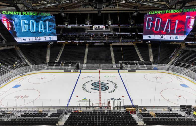 Jumbotrons hang over the ice at Climate Pledge Arena at Seattle Center on Saturday, Oct. 16, 2021. 218527