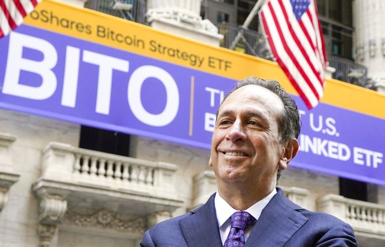 ProShares CEO Michael Sapir poses for photos outside the New York Stock Exchange before his company is listed, Tuesday, Oct. 19, 2021. ProShares will launch the country’s first exchange-traded fund linked to Bitcoin.