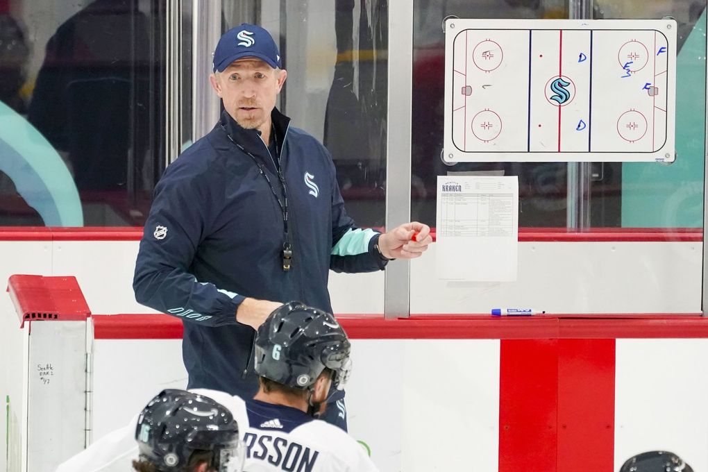 Seattle Kraken coach Dave Hakstol outlines a play during the team’s NHL hockey practice Thursday, Oct. 21, 2021, in Seattle. (Ted S. Warren / AP)