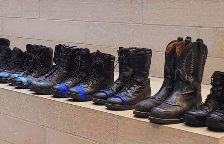 A group of Seattle firefighters, who are objecting to the COVID-vaccine mandate, turned in their boots at City Hall on Tuesday in protest.