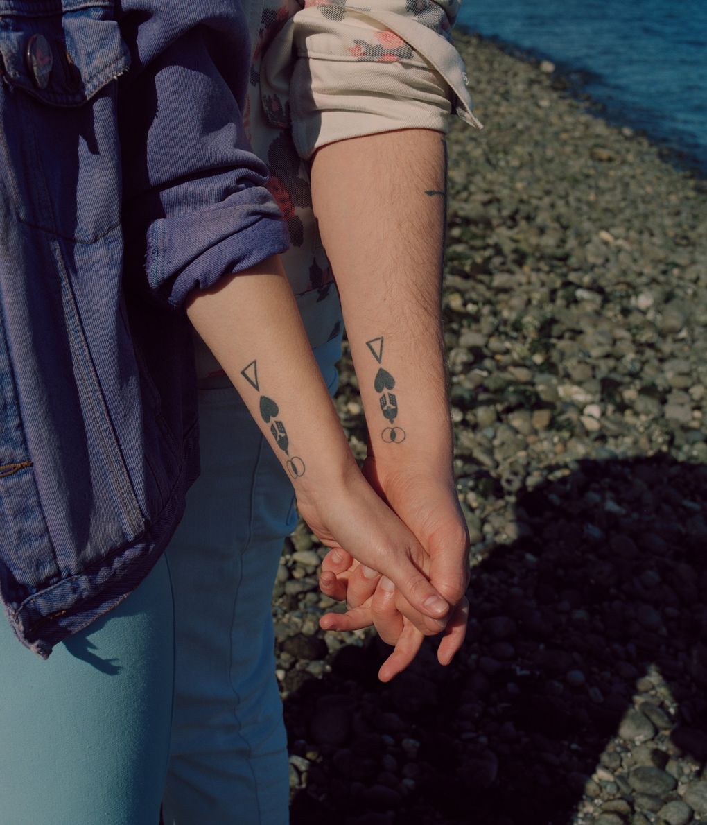 Amanda Knox with her husband, Christopher Robinson, and their matching tattoos. (Ricardo Nagaoka / The New York Times)