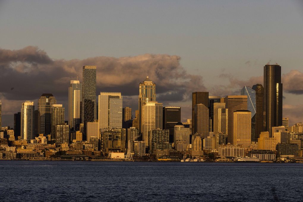 The sun sets on the Seattle skyline on Oct. 11. (Daniel Kim / The Seattle Times)