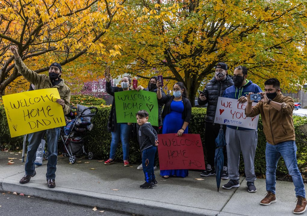 Family and members of
pastor Hector Garcia’s church cheer him on as he is discharged from an Everett rehab facility Wednesday. (Daniel Kim / The Seattle Times)